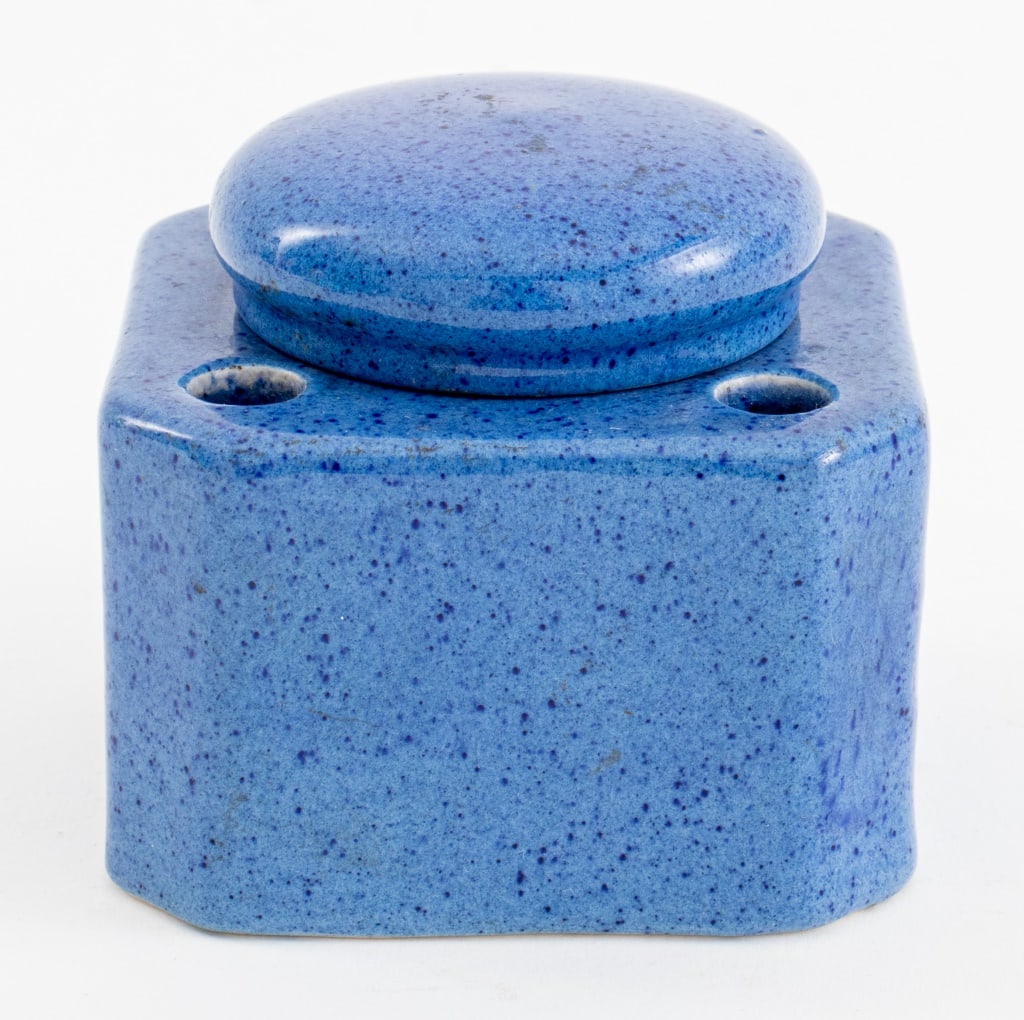 Moorcroft Blue Speckle-Glazed Ceramic Inkwell: William Moorcroft (English, 1872-1945) blue speckle-glazed ceramic inkwell, with impressed "Moorcroft" and "Made in England" marks to underside. 2.5" H x 3.25" W x 3.25" D.