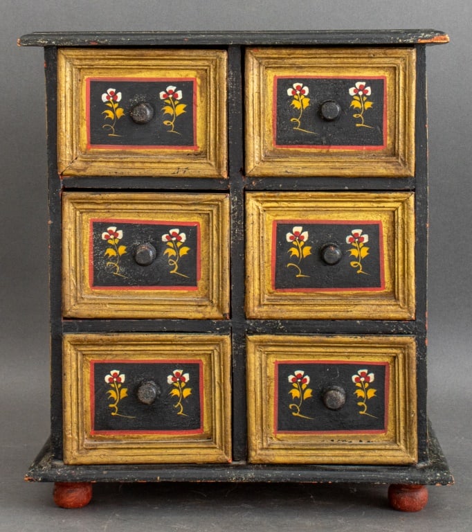 Turkish Hand-Painted Small Chest, 20th C: Turkish small chest, hand-painted with tulips and other flowers on a black ground, the rectangular top above six short drawers, possibly for jewelry. 17" H x 15" W x 9" D.
