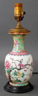 Chinese Famille Rose Vase Mounted Table Lamp: Chinese porcelain famille rose porcelain vase mounted as a table lamp, of baluster form, with quince branches and geometric designs. 13.5" H x 4.5" diameter.