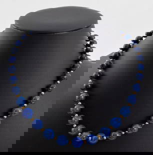 Lapis Lazuli 14K Yellow Gold Bead Necklace: Lapis lazuli bead necklace, strung on silk cord and knotted between each bead, featuring lapis beads approx. 8.0 - 10.0 mm, with interspersed 14K yellow gold rondelles approx. 3.0 mm, joined with 14K
