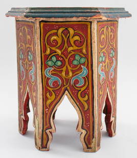 Moroccan Style Diminutive Painted Hexagonal Table: Moroccan style diminutive painted hexagonal table, the top (worn/damaged) surrounded by dark turquoise painted molding above six floral-decorated side panels. 14" H x 11.5" diameter.