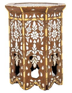 Moroccan Mother of Pearl & Wood Marquetry Table: Moroccan mother-of-pearl or abalone inlaid ebony and hardwood marquetry table, eight-sided, with floral ornament centered within a geometric pattern, above eight galleried sides. 19" H x 13.75 W x 13.