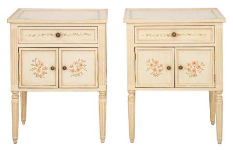 Italian Neoclassical Style Painted Commodes, Pair: Pair of Italian Neoclassical style small painted commodes, each with rectangular tops above two drawers on tapering columnar stop-fluted legs, the whole decorated in white with garlanded floral decora