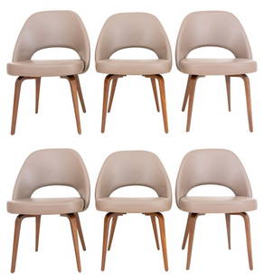 Saarinen Knoll Series 71 Wood Legged Chairs, 6: Set of six Eero Saarinen (Finnish/American, 1910-1961) for Knoll Mid-Century Modern executive chairs, designed in 1950, upholstered in taupe leather, raised on light walnut tapered legs, label and