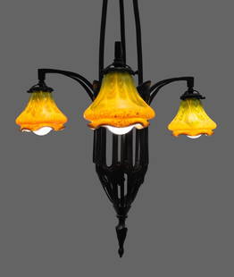 German Secessionist Bronze Loetz Glass Chandelier: German Secessionist brass chandelier, circa 1905, the pierced angular standard with Art Nouveau style fruit motif and three branches fitted with three Loetz shades in mottled gold and opalescent glass