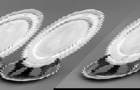 George III Sterling Silver Dinner Plates, 18 C., 4: George III sterling English silver place plates, or coverts, two pairs, on with maker's marks to underside for Orlando Jackson, London, 1772, and the other with marks of Wakelin & Taylor, London, 1777
