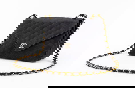 Chanel Black Satin Flap Shoulder Bag: Vintage Chanel quilted black satin flap bag with gold-tone metal chain strap and signature double CC logo closure mounted with rhinestones, silk lining, marked "CHANEL / MADE IN FRANCE" inside with se