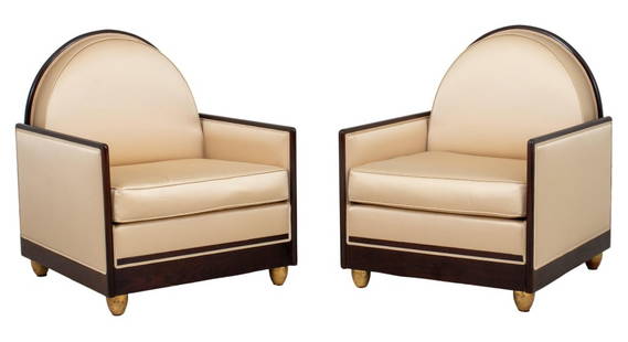 Ruhlmann Manner Art Deco Satin Armchairs, 2: Pair of Art Deco wooden arm chairs in the style of Emile-Jacques Ruhlmann (French, 1879-1933), circa 1930s, the arched backs, cushions, and rectangular arms upholstered in a muted gold-tone silk, each