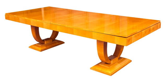 Art Deco Style Pearwood Extending Dining Table: Art Deco style pearwood extending dining table with extending top above two pedestal bases in the manner of Jules Leleu (French, 1883-1961) for Maison Leleu, the arched supports on plinth bases, with