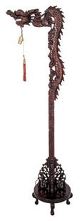 Chinese Carved Wood Dragon Floor Lamp: Chinese carved wood floor lamp, in the form of a dragon with pendant light fixture on a circular four footed base. 67" H x 20" W x 15" D.