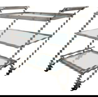 Treitel Gratz Attr. Modernist Deco Steel Trolley: Treitel Gratz attributed Modernist chromed steel tea or cocktail trolley or bar cart, rectangular and with arching handles above columned supports conjoined by an undertier on casters. 27" H x 28" W x