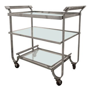 Treitel Gratz Attr. Modernist Deco Steel Trolley: Treitel Gratz attributed Modernist chromed steel tea or cocktail trolley or bar cart, rectangular and with arching handles above columned supports conjoined by an undertier on casters. 27" H x 28" W x