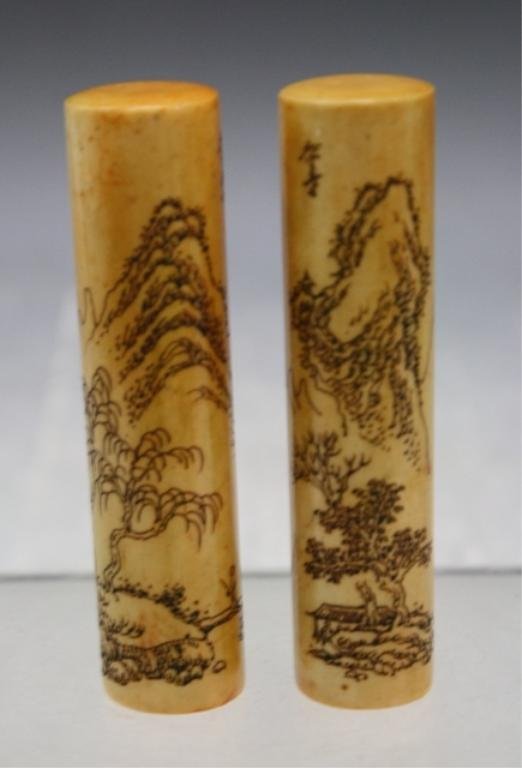 Chinese Pair of Soapstone Seals: Pair of cylindrical seals with incised landscapes, soapstone, China; marked. Dimensions: each approximately 3-1/2"H x 3/4" diameter