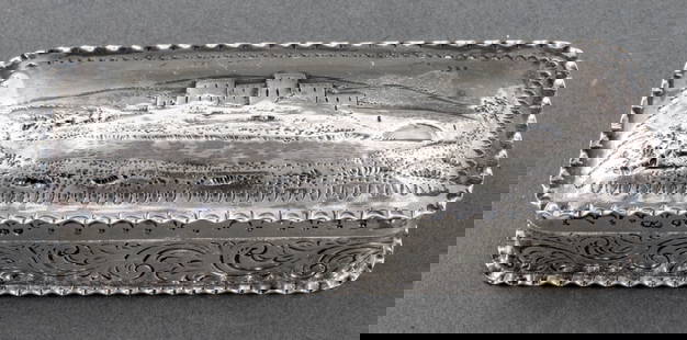 Victorian Sterling SIlver Snuffbox, 1885: Victorian sterling silver snuffbox, with maker's marks of William Comyns & Sons, London, 1885, the lid repousse with a view of the Scottish highlands, the sides with floral scrollwork engraving. Weigh