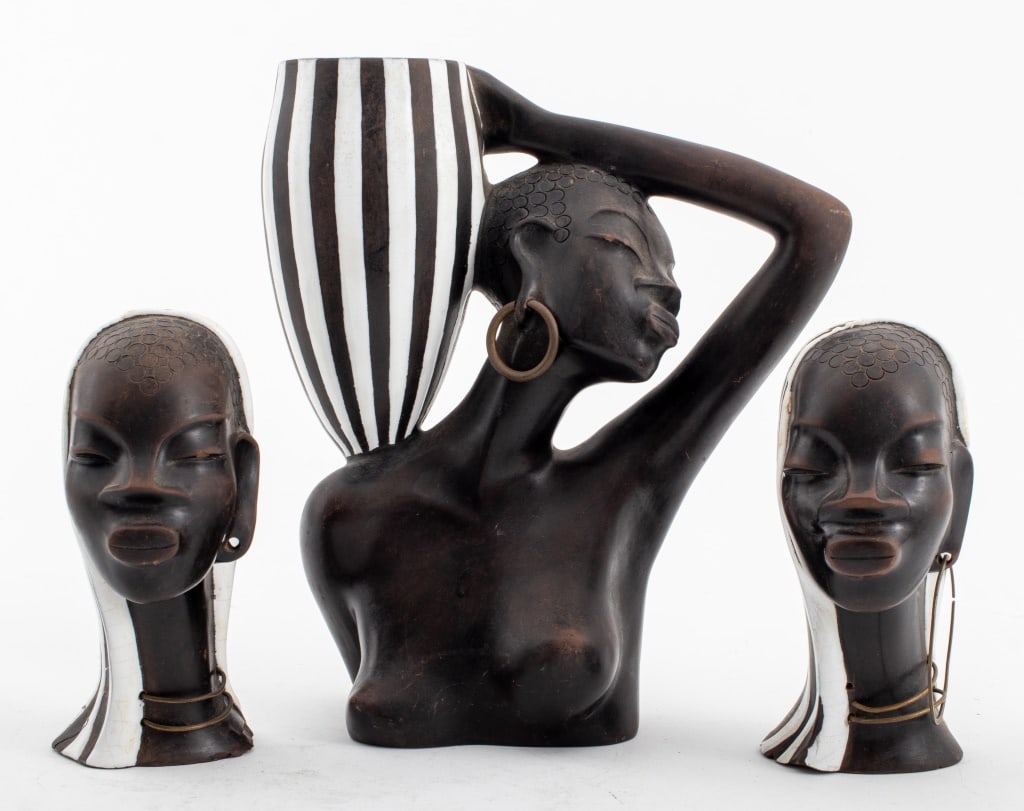 Leopold Anzengruber Female Sculptures, 3: Leopold Anzengruber (Austrian, 1912-1979), three female ceramic sculptures, one partially nude bust of a woman holding a vase, and two smaller female heads adorned with jewelry, signed and marked "Anz
