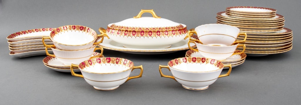 Royal Crown Derby China Heraldic Maroon Service: Royal Crown Derby English bone china dinner service, each piece marked, in the "Heraldic Maroon" pattern, comprising: nine dinner plates, seven luncheon plates, four bread plates, six two-handled soup