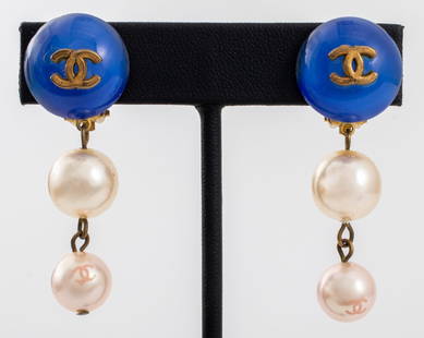 Chanel Runway Faux Pearl Clip Earrings, 2000: Pair of Chanel Runway Faux Pearl and Blue Glass Gold-Tone Metal Clip Earrings, Spring 2000, marked "(c) CHANEL (r) / 00 CC P / MADE IN FRANCE" to reverses. 2" L x 0.75" W. Provenance: From a 140 East