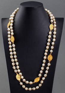 Chanel Faux Pearl Sautoir Necklace, 1981: Chanel Faux Pearl Sautoir Necklace, 1981, marked "CHANEL" and dated to gold-tone metal plaque. 56" L. Provenance: From a 140 East 56th Street estate. Keywords: Vintage, Designer, Costume jewelry, Coco