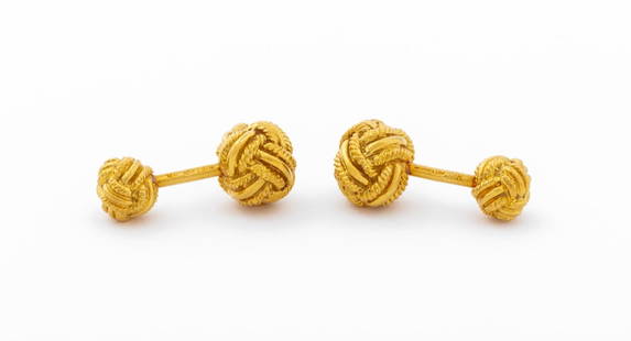 Schlumberger Tiffany & Co. 18K Knot Cufflinks: Tiffany & Co. 18K Yellow Gold Fixed Cufflinks, designed by Jean Schlumberger, featuring knots crafted with twisted and mirror finished wires, joined with solid round posts, marked: "SCHLUMBERGER TIFFA