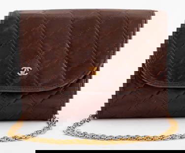 Chanel Quilted Brown Leather Front Flap Handbag: Chanel Quilted Brown Leather Front Flap Handbag, Circa 1980s, with gold-tone metal chain strap, marked "CHANEL / PARIS / MADE IN FRANCE" inside. 5.25" H x 6.75" W x 2" D. Provenance: From a 140 East 5