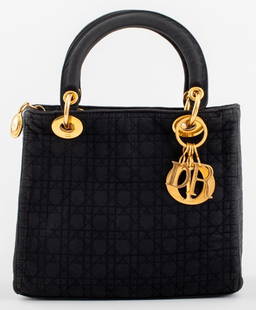 Christian Dior Lady Dior Cannage Quilt Bag: Christian Dior 'Lady Dior' Cannage Quilt Black Nylon Handbag, with gold tone hardware and red interior, label inside. 12.5" H x 9.5" W x 4.5" D.