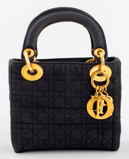 Christian Dior Lady Dior Cannage Quilt Bag: Christian Dior 'Lady Dior' Cannage Quilt Black Nylon Handbag, with gold tone hardware, shoulder strap and red interior, label Inside. 9" H x 7" W x 3" D.