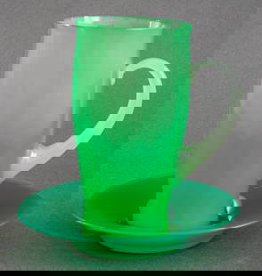 Carder Steuben Attr. Green Jade Glass and Dish: Carder Steuben attributed green jade and alabaster glass mug, together with a green jade glass dish. Mug: 5.75" H x 4.5" W x 3" D; dish: 6" Diameter.
