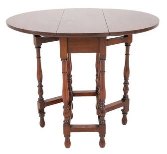 William & Mary Style Mahogany Drop Leaf Low Table: William and Mary style mahogany drop leaf table having two D-shaped drop leaves raised on turned wood gateleg base. Open: 26.5" H x 32" W x 26.75" D.