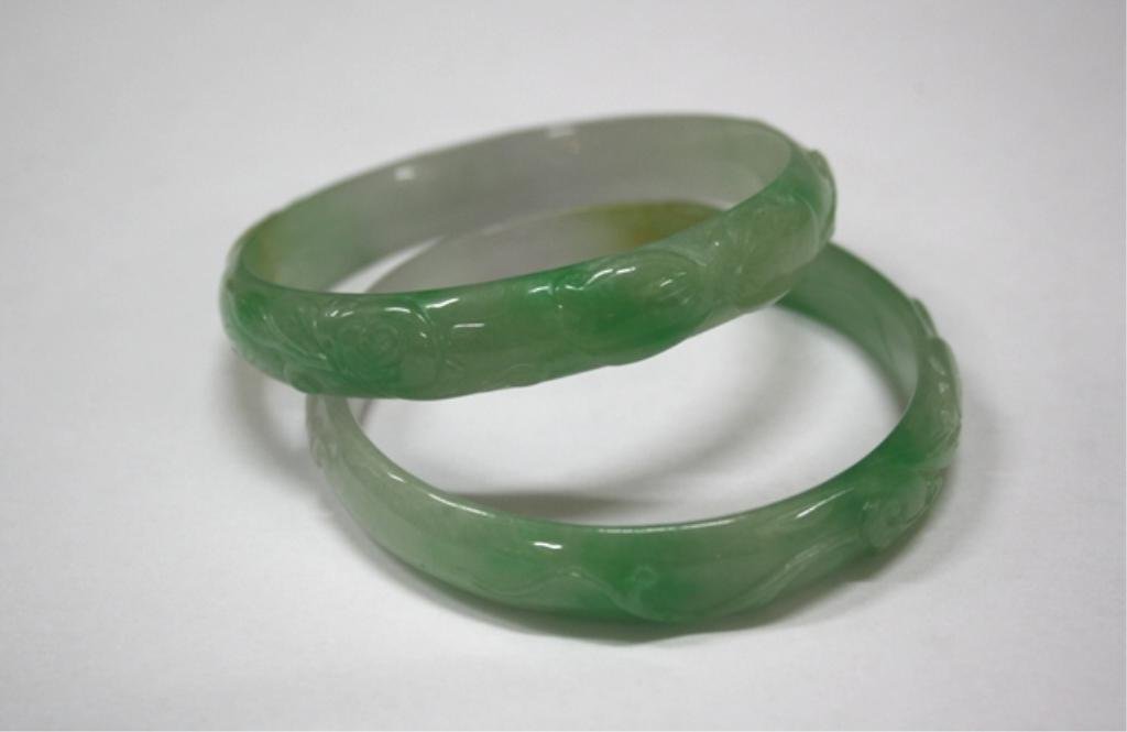 Chinese Carved Pair of Jade Bangles w/ Bats: Pair of carved jade bangles with bats and mushrooms, China; unmarked. Dimensions: 7" diameter