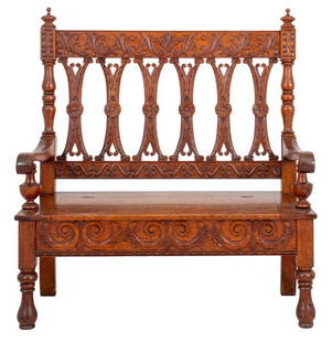 Renaissance Style Hall Bench or Settee: Renaissance Revival style hall bench or settee, with carved crest rail with turned finials above carved back splats between scrolling arms above a square hinged seat above storage on carved seatrail a
