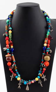 Native American Sterling Silver Charm Necklace: Double strand necklace with polychrome glass and crystal stone beads, mounted with Native American silver charms of various forms including figural and animalier, some marked "STERLING / 925", with ho