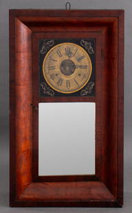 Bristol American Mahogany Wall Clock, ca. 1850: American mahogany wall clock by the The Bristol Brass & Clock Company of Bristol, Connecticut, and with label to inside rear wall, the ogee frame surrounding a part verre eglomise glass panel revealin