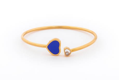 Chopard Happy Hearts 18K Diamond Blue Stone Bangle: Chopard Happy Hearts Collection Bangle Bracelet, fabricated in 18K rose gold, featuring one floating diamond weighing approx. 0.05 carat, further decorated with one blue heart shaped cabochon, worn on
