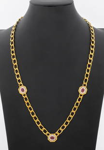 18K Yellow Gold Ruby Diamond Necklace: 18K Yellow Gold Ruby Diamond Necklace, featuring 3 prong set cabochon rubies weighing a total of approx. 3.15 carats, further adorned with 30 pave set round brilliant diamonds weighing a total of