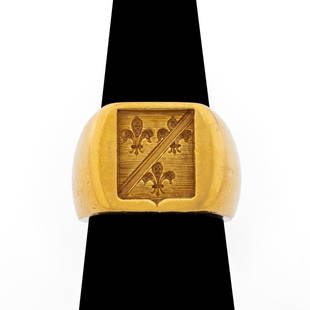 18K Yellow Gold Crest Ring: 18K Yellow Gold Ring, designed as crest ring featuring three fleur-de-lis emblems framed in a shield with bisecting line, marked: "18K". Measuring approx. US size 6, 14.4 mm across widest point, 20.8