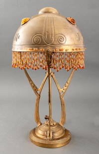 Austrian Secessionist Gem-Set Brass Table Lamp: Austrian Secessionist Gem-Set Brass Table Lamp, circa 1910s, mounted with amber-tone chunk jewels and fitted with two light bulb sockets. 19.75" H x 10.25" Diameter. Keywords: Antique, Art Nouveau, Ju