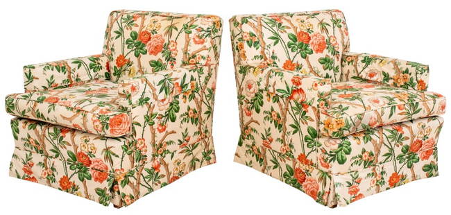Chintz Upholstered Skirted Arm Chairs, Pair: Pair of Chintz Upholstered Skirted Arm Chairs, with square backs and drop in cushions between scrolling arms and skirted base. 32" H x 29" W x 33" D; seat: 18" H. Provenance: From a 140 East 56th Stre