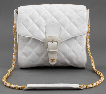 Chanel Quilted White Leather Handbag, ca. 1980s: Chanel Quilted White Leather Handbag, tag present, with gold-tone metal hardware, chain link strap, and magnetic buckle closure, circa 1980s, marked "CHANEL / MADE IN ITALY" with serial number "049707