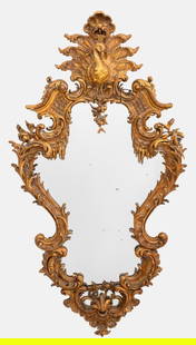 Italian Belle Epoque Venetian Rococo Style Mirror: Italian Belle Epoque Venetian Rococo Mirror, 19th Century, likely Turin, with elaborate carved rococo style surround with traces of gilding, the cornice centering a peacock, the attribute of the godde