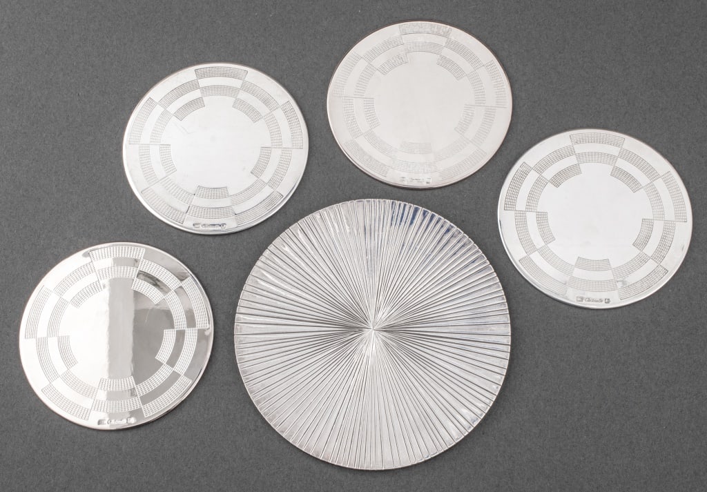 Christofle Silverplate Coasters & Wine Coaster, 5: Group lot of five pieces of vintage Christofle silverplate coasters, four coasters chased with geometric grid designs, each marked "Christofle" with maker's marks, and one Michele Oka Doner (American,