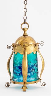 English Arts & Crafts Gilt Metal Lantern: English Arts & Crafts Gilt Metal Lantern, mottled blue painted glass. 15.5" H x 9.5" Diameter. Provenance: From a Manhattan Collector. Keywords: Lighting, Pendant lamp, Hanging, Scrolling design