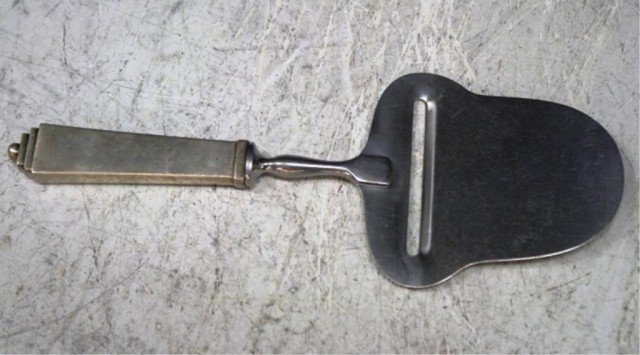 George Jensen Sterling Deco Pyramid Cheese Slicer: Georg Jensen sterling silver and stainless steel art deco pyramid pattern cheese slicer or cutter, Denmark; hallmarked. Hallmark on handle: Georg Jensen Sterling Denmark; on slicer: Stainless Steel Ra