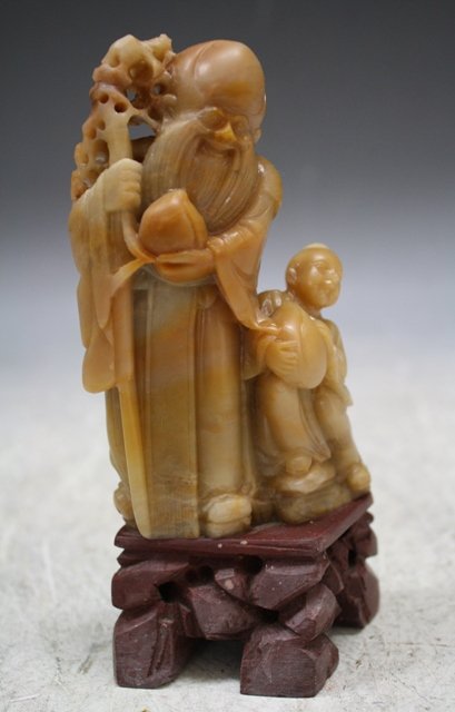 Chinese Shoushan Soaptone Lohan Figure: Carved Shoushan soapstone figure of a Lohan and boy, China; unmarked. Dimensions: 6"H x 3"W x 2-1/4"D