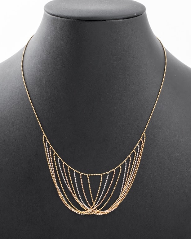 14K Tri-Gold Diamond Cut Bib Necklace: 14K Tri-Gold (white, yellow, and rose gold) Diamond-Cut Overlap Bib Style Necklace with lobster clasp, marked: "RCI / 14KT / 585". Necklace measures 17.0" L x 1.75" W at widest section. Approx: 3.3 dw