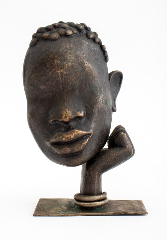 Hagenauer Attr. Bronze Head in Hand Sculpture: Hagenauer Werkstatte Attributed Bronze Head in Hand Sculpture, apparently unmarked. 5.75" H x 3.5" W x 2" D. Keywords: Franz Hagenauer, African bust, Statue, Art Deco