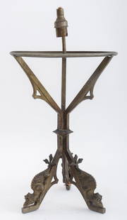 Gothic Revival Tripodal Desk Lamp Base, 1920s: Gothic Revival Bronze Tripodal Desk Lamp, with traces of silvering, the legs with stylized creatures to feet. 17" H x 9" Diameter. Provenance: From a Manhattan collector. Keywords: Lighting, Antique,