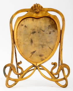 French Art Nouveau Gilt Metal Vanity Mirror: French Art Nouveau Gilt Metal Vanity Mirror, early 20th century, with easel stand. Mirror lacking. 11.75" H x 9" W x 5" D. Provenance: From a Manhattan collector. Keywords: Art Nouveau, Accessories, V