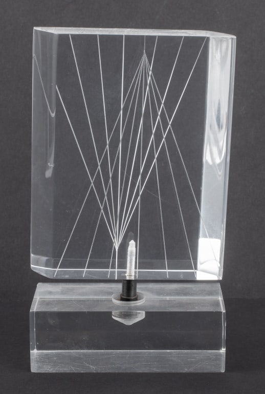 Modern Articulated Lucite Ornamental Sculpture: Modern Ornamental Lucite Sculpture, with an articulated geometric form with incised lines mounted on a rectangular base. 7" H x 4" W x 2" D. Provenance: Property from the Long Island residence of a co