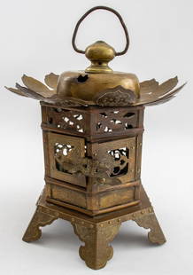 Japanese Engraved Brass Lantern, ca. 1900: Japanese Engraved Brass Lantern, circa 1900, of hexagonal reticulated form with bell-lotus form top with handle on six shaped and engraved legs. 15" H x 11" Diameter. Provenance: From a Manhattan coll