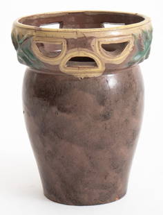 Austrian Arts & Crafts Studio Pottery Vase: Austrian Arts and Crafts Studio Pottery Vase with a mottled brown black glaze, the rim with yellow and green glaze and pierced with half moon shapes and molded double X design, impressed "Made in Aust